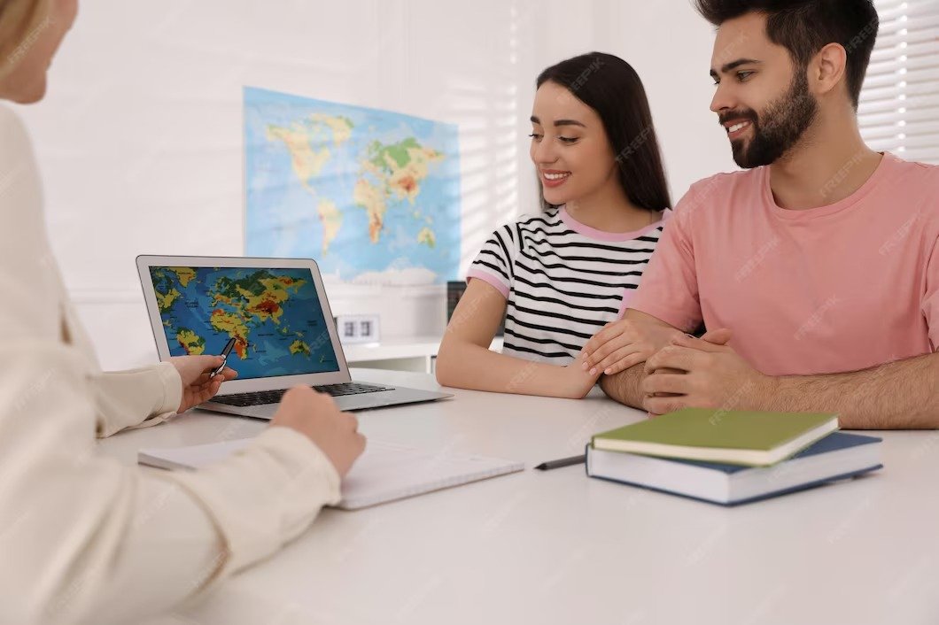 imgi 203 manager showing map couple laptop desk travel agency 495423 37566