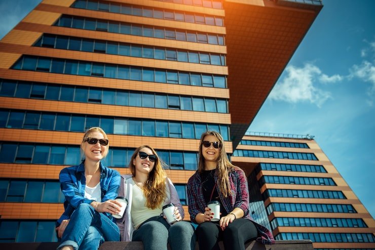 women drink coffee from disposable glasses 180532 990
